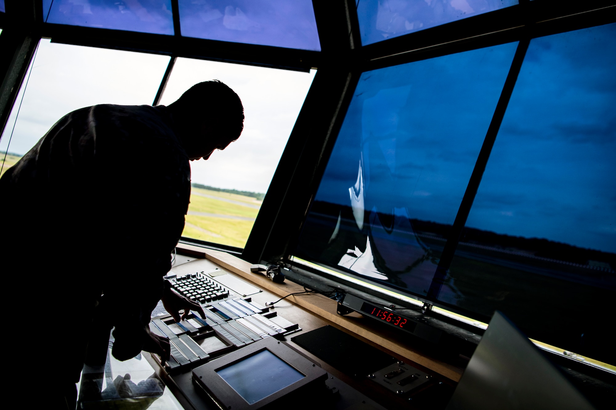 U.S. Air Force Staff Sgt. Troy Ondrey, 420th Expeditionary Air Base Squadron air traffic control tower watch supervisor, monitors his workstation during an Agile Combat Employment exercise at RAF Fairford, England, Sept. 13, 2021. Airmen from the 501st Combat Support Wing, 100th Air Refueling Wing and 352d Special Operations Wing partnered to conduct an ACE exercise to test their overall readiness and lethality capabilities. The exercise enables U.S. forces in Europe to operate from locations with varying levels of capacity and support. (U.S. Air Force photo by Senior Airman Eugene Oliver)