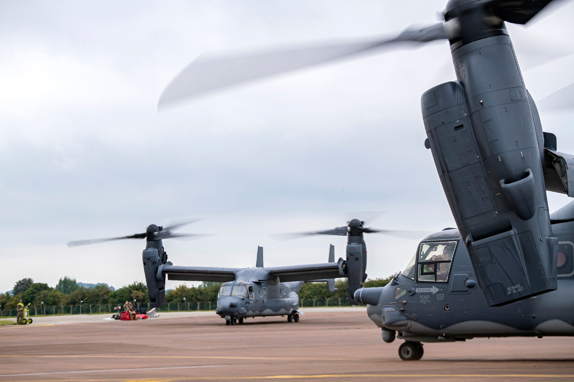 Two CV-22A Ospreys assigned to the 352d Special Operations Wing prepare to take off during an Agile Combat Employment exercise at RAF Fairford, England, Sept. 13, 2021. The exercise enables U.S. forces in Europe to operate from locations with varying levels of capacity and support. This further ensures Airmen and aircrews are postured to deliver lethal combat power across the full spectrum of military operations.(U.S. Air Force photo by Senior Airman Eugene Oliver)