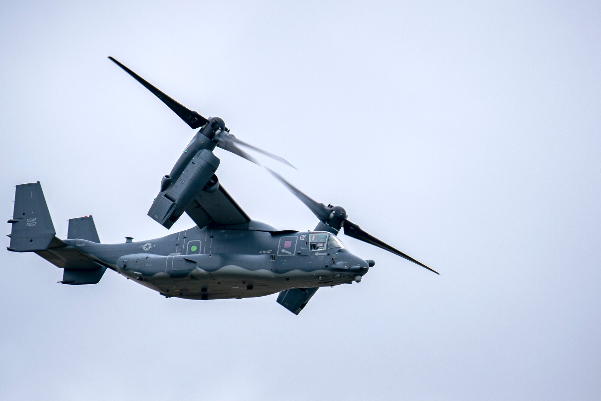 A CV-22A Osprey assigned to the 352d Special Operations Wing flies overhead during an Agile Combat Employment exercise at RAF Fairford, England, Sept. 13, 2021. Airmen from the 501st Combat Support Wing, 100th Air Refueling Wing and 352d SOW partnered to conduct an ACE exercise to test their overall readiness and lethality capabilities. The exercise enables U.S. forces in Europe to operate from locations with varying levels of capacity and support. (U.S. Air Force photo by Senior Airman Eugene Oliver)