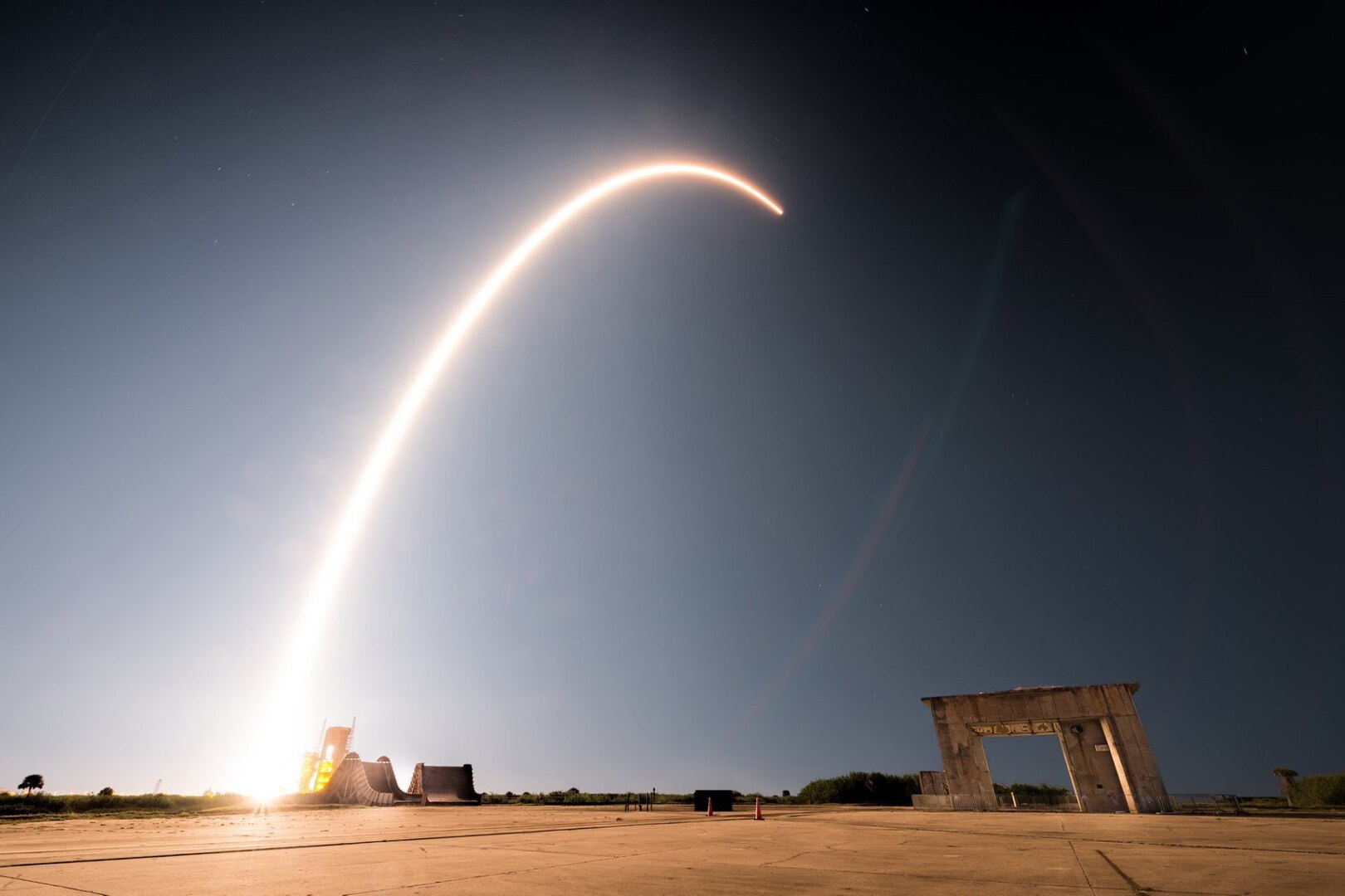 Rocket arches through the sky to orbit.