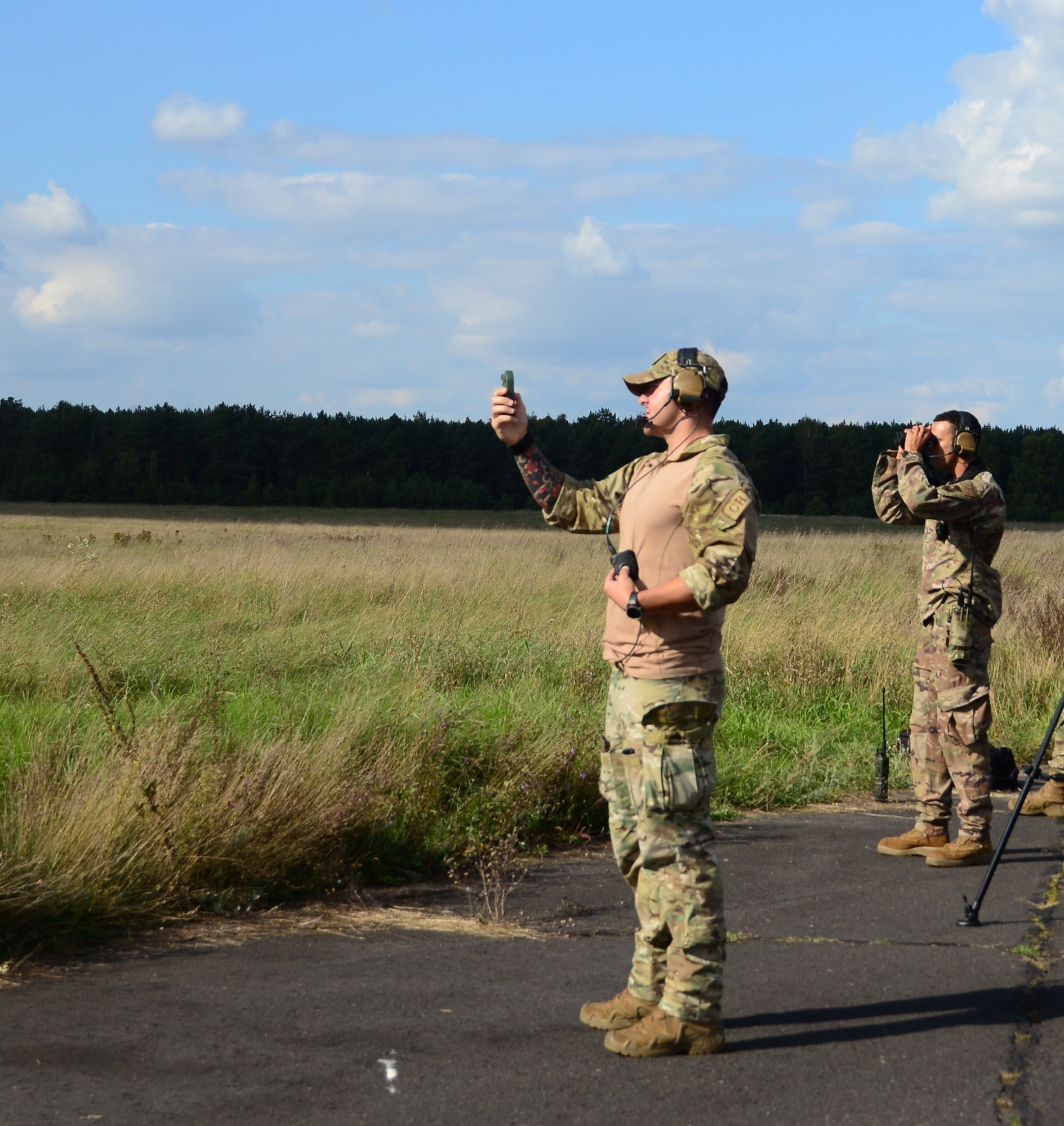 Airman takes measurements on airfield.