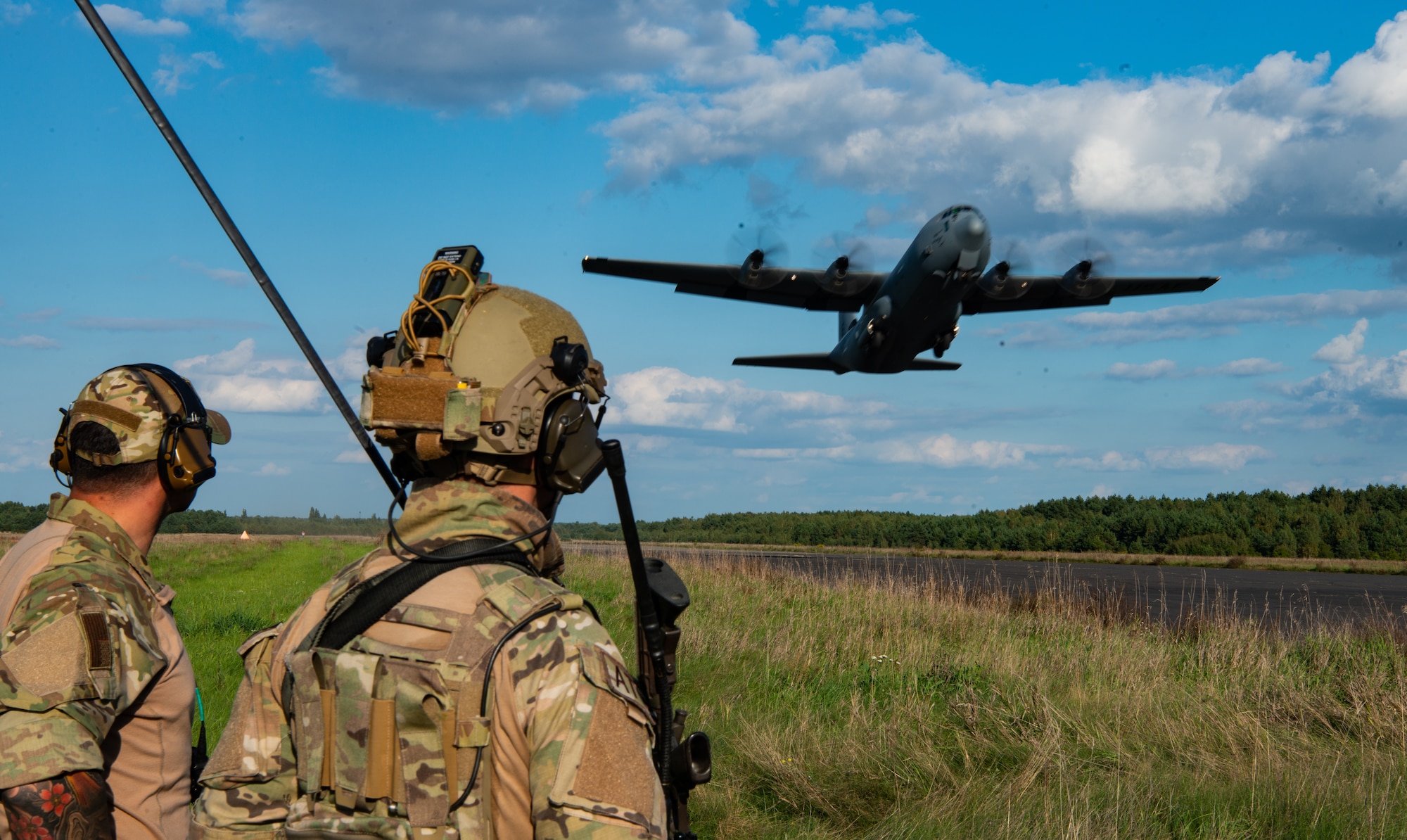 Aircraft lands on airfield.