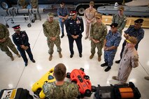 Vice Adm. Brad Cooper, commander of U.S. Naval Forces Central Command (NAVCENT), U.S. 5th Fleet and Combined Maritime Forces, center right, along with Major Gen. Ala Abdulla Seyadi, commander of the Bahrain Coast Guard, center left; and Rear Adm. Mohammed Yousif Al Asam, commander of the Royal Bahrain Naval Force, right, listen to a presentation on remotely operated unmanned underwater vehicles. During the visit, Bahraini leaders committed to partnering with NAVCENT to accelerate integration of new unmanned systems into regional maritime operations. (U.S. Navy photo by Mass Communication Specialist 2nd Class Mark Thomas Mahmod)