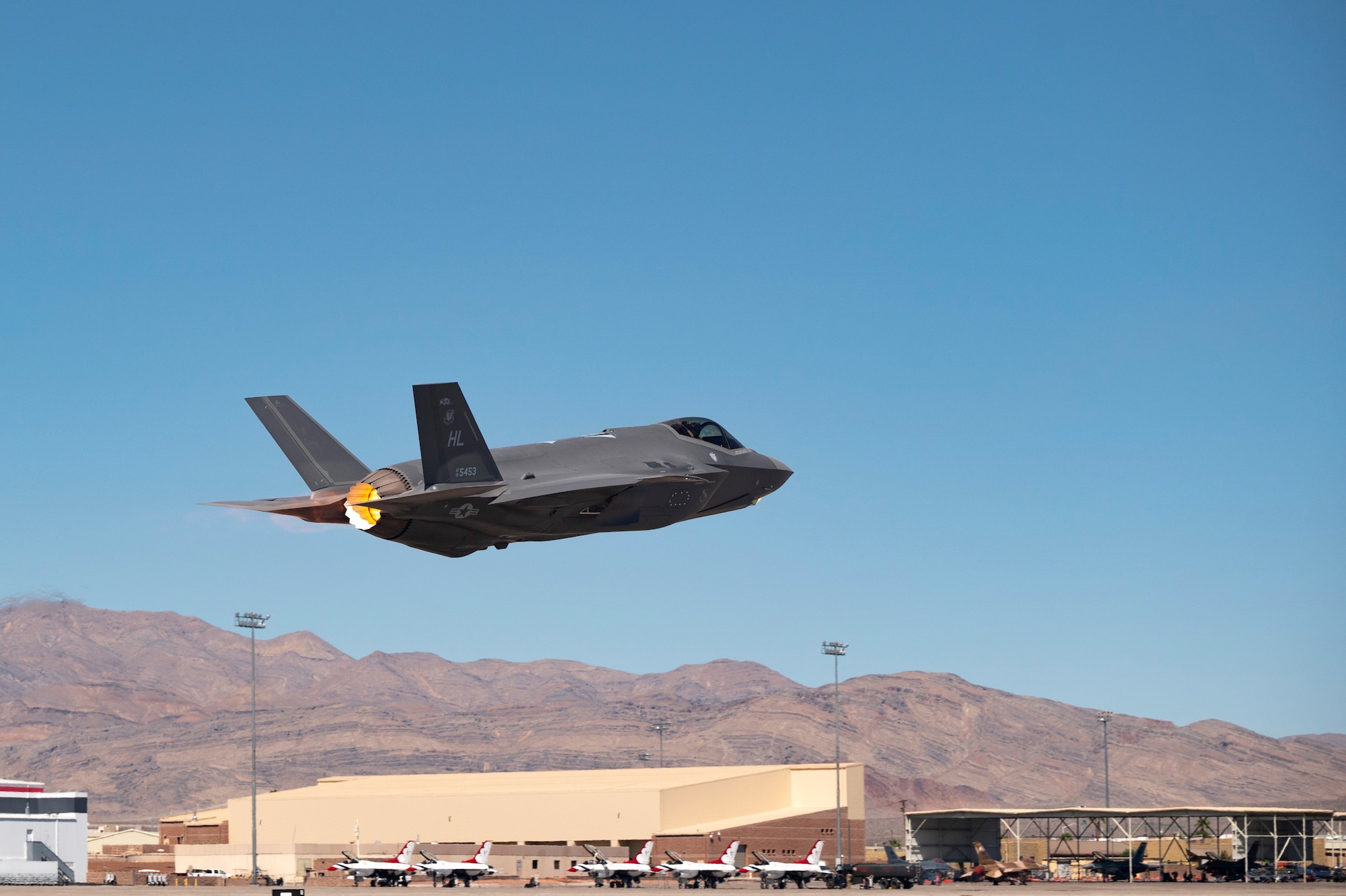 An F-35A Lightning II takes off to complete the final test exercise of the nuclear design certification process at Nellis Air Force Base, Nevada, Sept. 21, 2021 . Test pilots flew to the Tonopah Test Range at Nellis AFB and released two B61-12 Joint Test Assemblies from operationally realistic flight envelopes. (U.S. Air Force photo by Airman 1st Class Zachary Rufus)