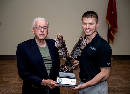 Jim Cameron (left), owner of Cameron Glass,  and Chris Ashworth, employee of Cameron Glass and also an Oklahoma National Guardsmen, pose with the Secretary of Defense Employer Support Freedom Award after an award ceremony at the Broken Arrow Armed Force Reserve Center, Sept. 21, 2021. Ashworth nominated Cameron Glass for their exceptional support and accommodations for Oklahoma Guardsmen and their families. (Oklahoma National Guard photo by Sgt. 1st. Class Mireille Merilice-Roberts)