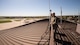 U.S. Air Force Tech. Sgt. Anthony Cooper, 375th OSS NCOIC of airflow manager operations, and Senior Airman Samir Ragih, 375th Operation Support Squadron airfield management shift lead, evaluate the runway on Scott Air Force Base, Illinois Sept. 8, 2021. The airfield management Airmen have to ensure that they focus on the attention to detail aspect of their skillset when evaluating the runway to catch potential hazards, or emergencies. (U.S. Air Force Photo by Airman 1st Class Isaac Olivera)