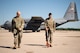 U.S. Air Force Senior Airman Samir Ragih, 375th Operation Support Squadron airfield management shift lead, and Tech. Sgt. Anthony Cooper, 375th OSS NCOIC of airflow manager operations, measure the distance between two C-130 on Scott Air Force Base, Illinois Sept. 8, 2021. The airfield management Airmen ensure that the Aircraft are properly placed to ensure that they utilize their space, while keeping the mission safe.(U.S. Air Force Photo by Airman 1st Class Isaac Olivera)