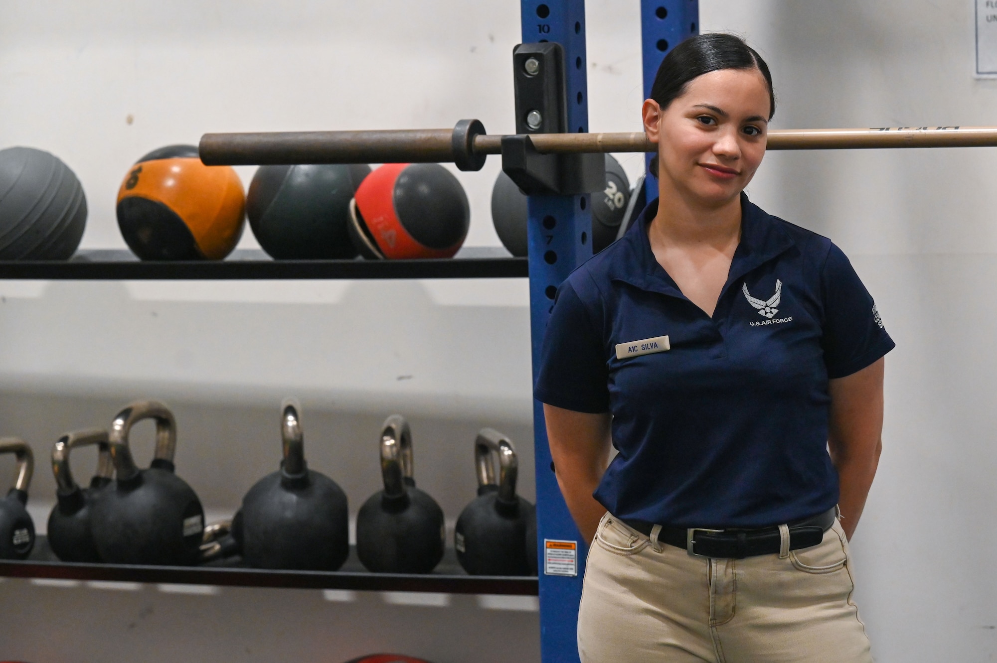 a woman stands inside gym
