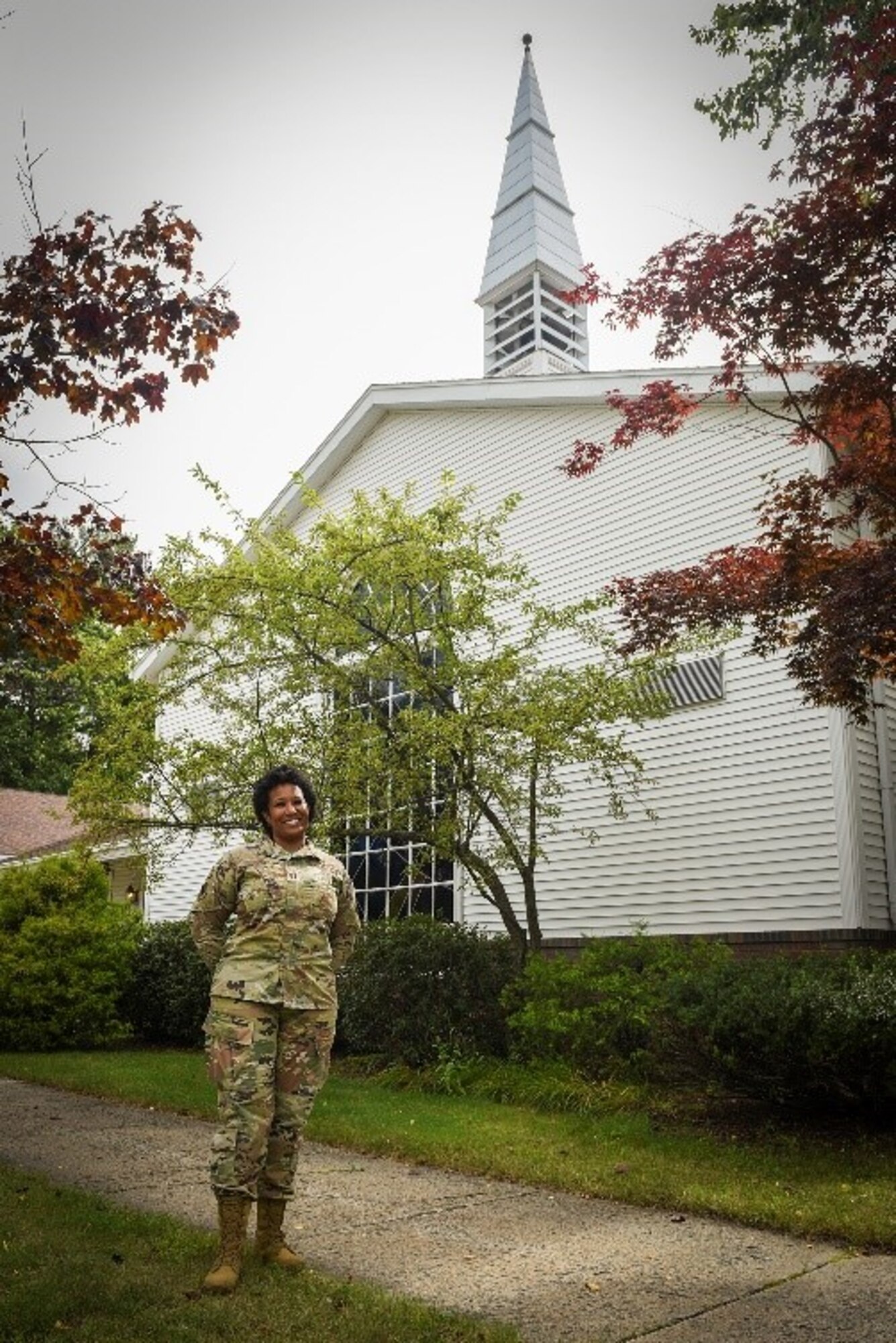 Chaplain (Capt.) Kimberly Hall, installation chaplain, stands outside the installation chapel