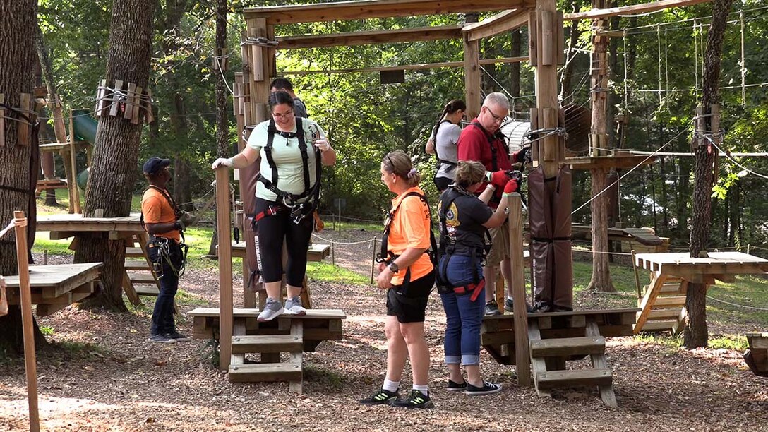 U.S. Army Corps of Engineers Nashville District employees participating in the LDP II make it through their first obstacle at the Adventure Park in Nashville, Tennessee, before facing more challenging portions of the ropes course.