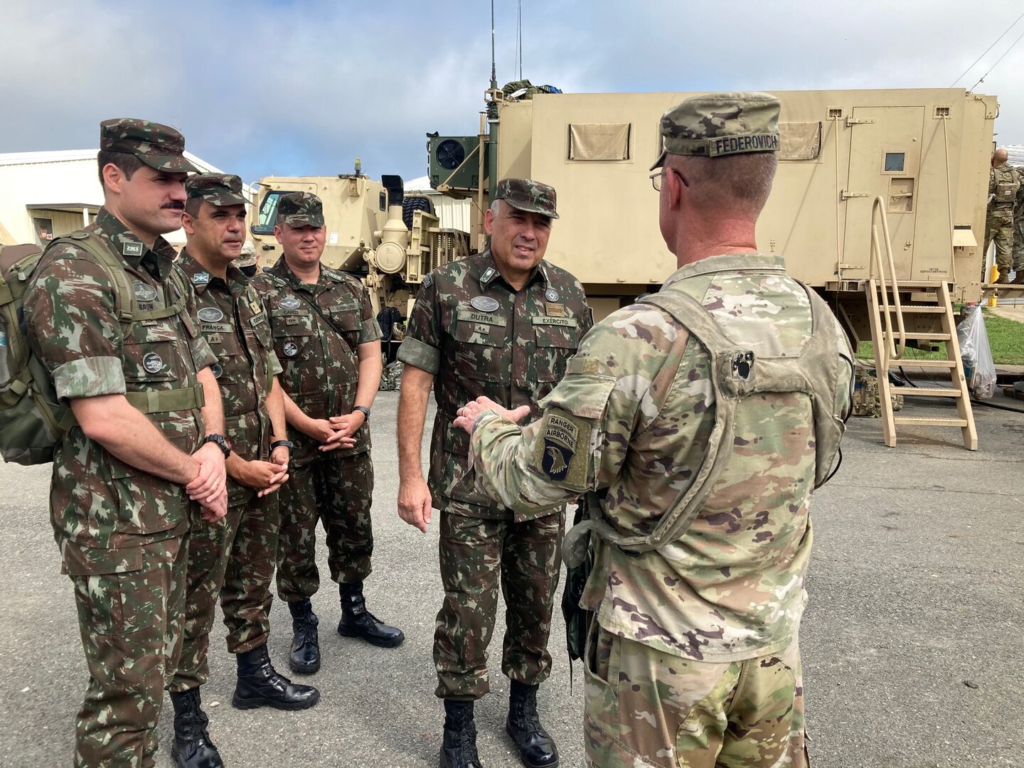 Lt. Gen. Gustavo Dutra (center), Brazil Army Chief of Land Force Preparation, receives a brief from Col. Mark Federovich