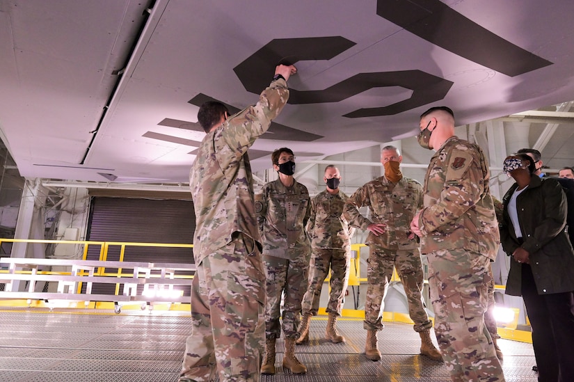 Airmen check the advantages of new aircraft stands.