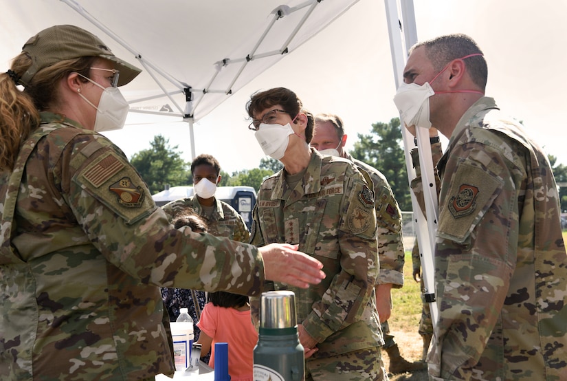 An airman briefs a general.