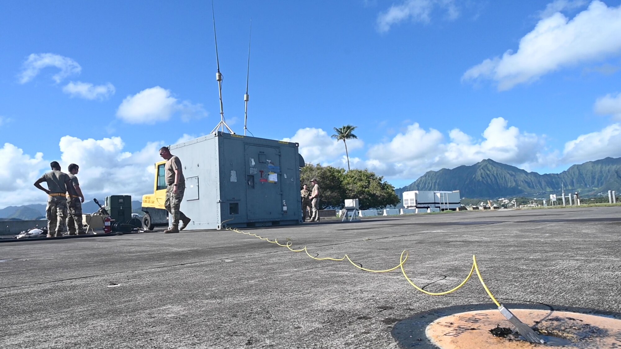 Airmen participating in Exercise Agile Combat Employment Reaper set up a containerized dual control segment Sept. 9, 2021, on Marine Corps Base Hawaii, Hawaii. Exercise ACE Reaper is an opportunity to conduct training with joint partners in a maritime environment and in a different airspace. (U.S. Air Force photo by Airman 1st Class Adrian Salazar)