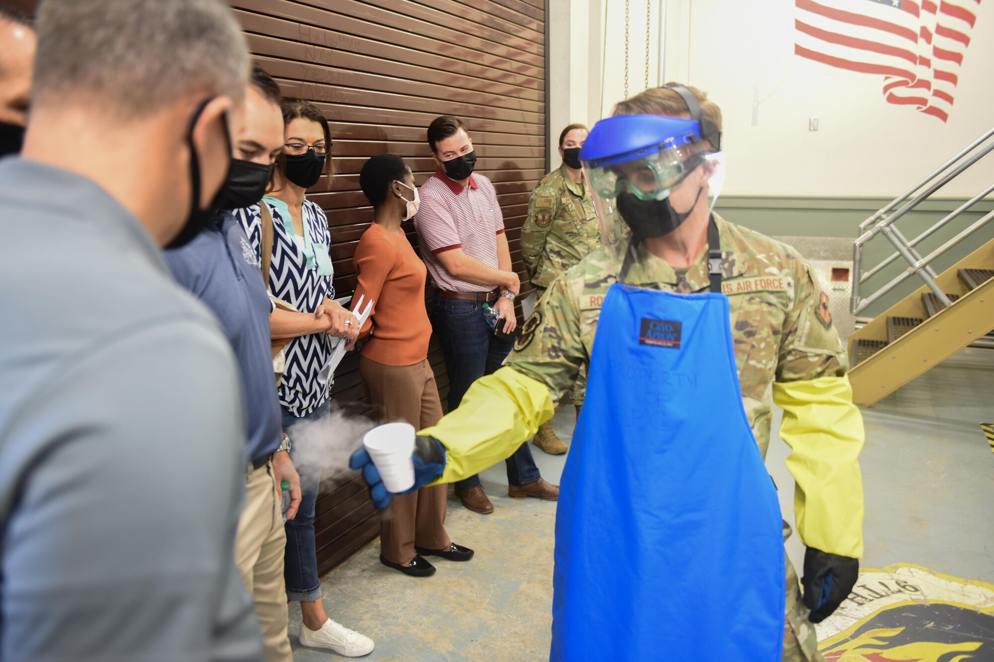 U.S. Air Force Senior Airman Garrett Rockwell, 97th Medical Logistics Flight medical materiel specialist, demonstrates the safe handling of dry ice to honorary commanders at Altus Air Force Base, Oklahoma, Sept .17, 2021. The 97th Medical Logistics Flight provides medical and non-medical materiel equipment, maintenance and services, and manages war reserve materiel and transportation in support of the medical mission. (U.S. Air Force photo by 2nd Lt Cameron Silver)