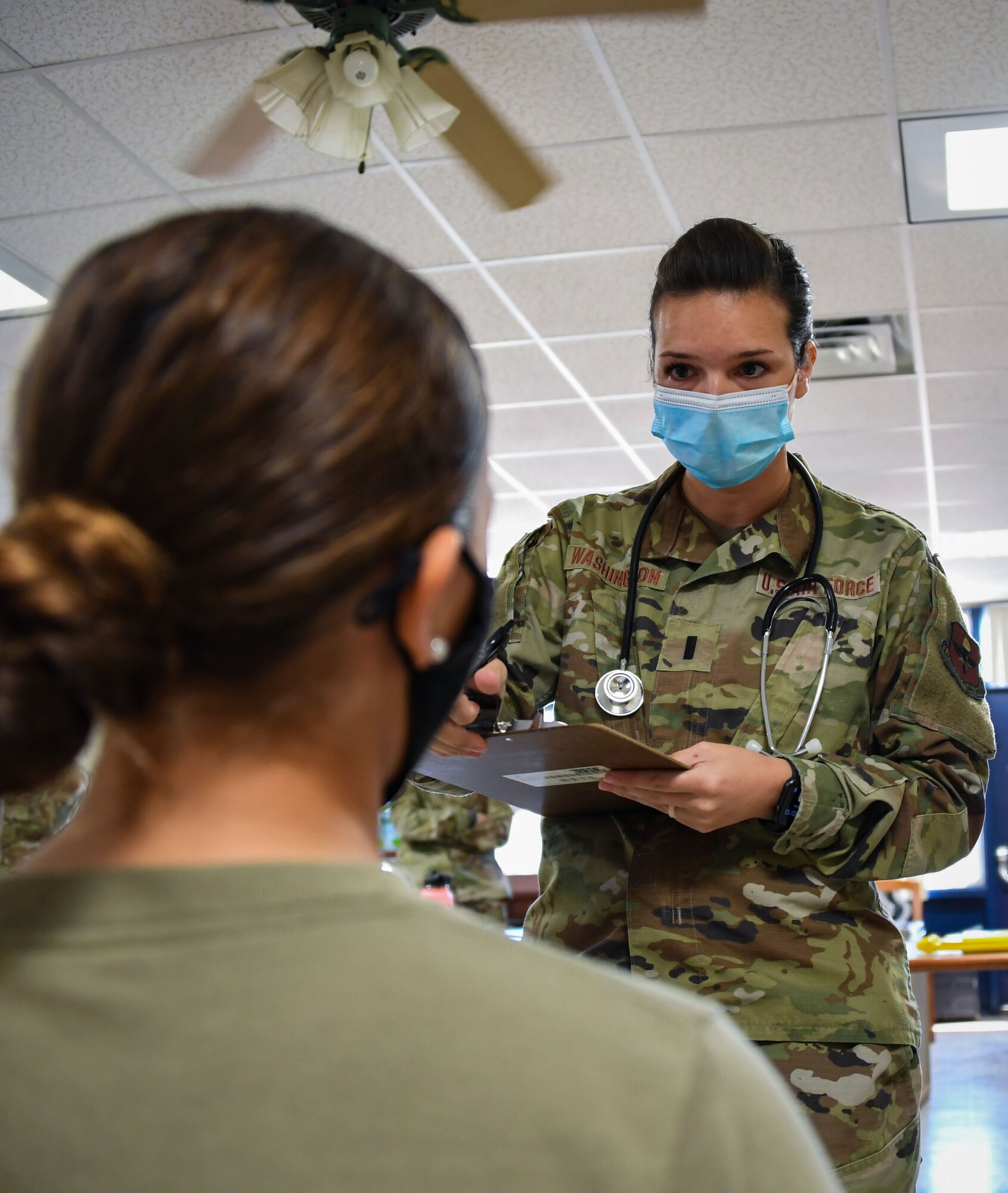 1st Lt. Rachel Washington, a physician assistant with the 82nd Operation Medical Readiness Squadron, asks a patient questions during a Ready Eagle exercise