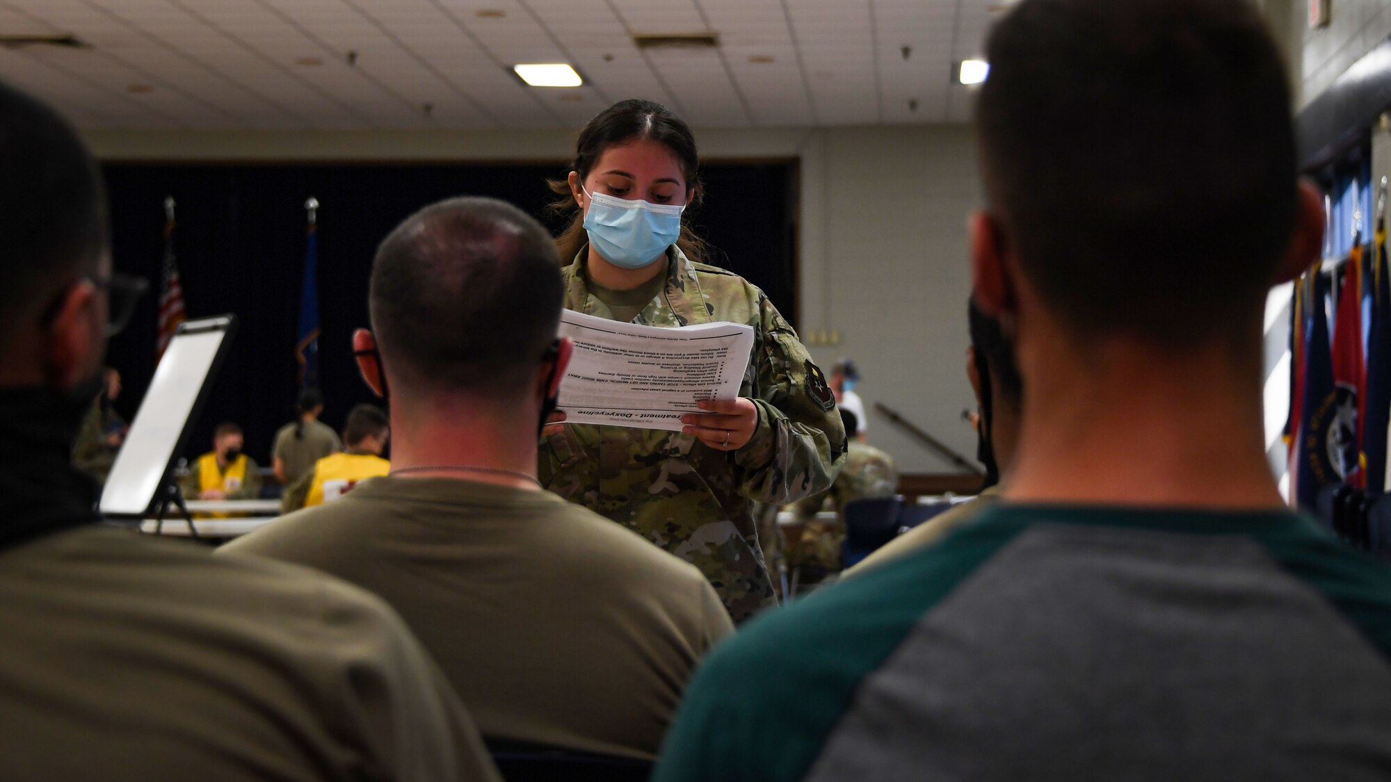 Senior Airman Sheily Sotelo Valencia goes over information on Anthrax with a group of Airmen during a Ready Eagle exercise