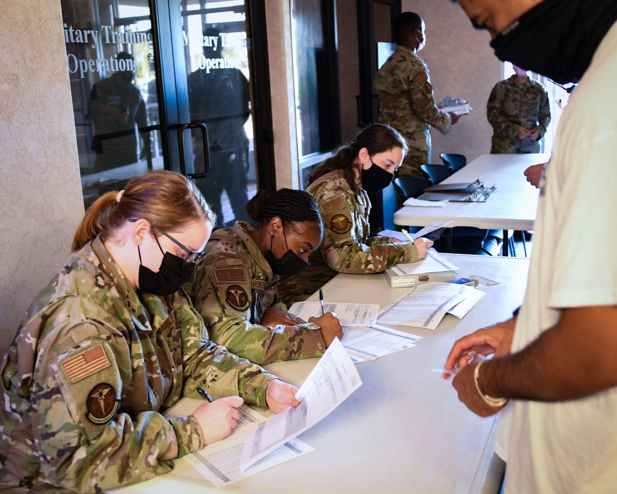 82nd Medical Group personnel check paperwork during a Ready Eagle exercise