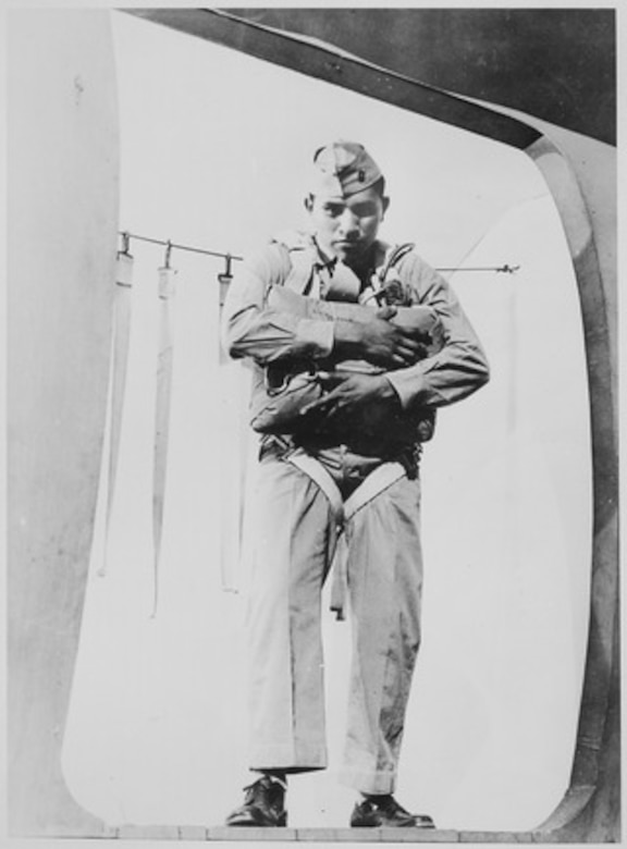 Marine stands in doorway.