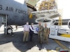 Representatives from the Ministry of Health and Population, USAID and the Utah National Guard greet each other as medical supplies to help aid Nepal’s COVID-19 response are offloaded from a KC-135 Stratotanker from the Utah National Air Guard.