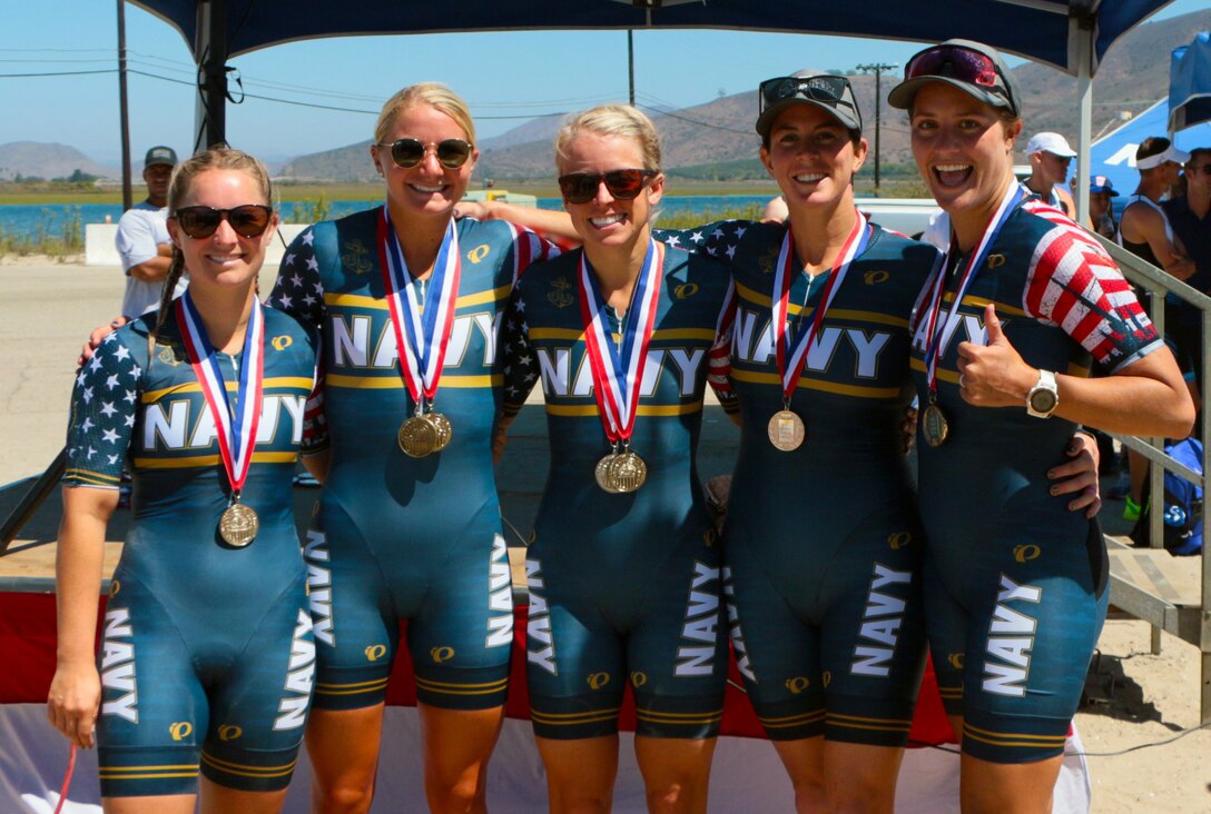 Navy Women capture gold at the 2021 Armed Forces Triathlon Championship held from 8-12 September.  Pictured are:  Lt. Katherine Cullingford, NAS Jacksonville, Fla.; Ensign Carolyn Riggs, US Naval Academy, Md.; Lt. Heather Ireland, NSA Hampton Roads, Va.; Lt. Moira Molloy, Naval Base San Diego, Calif.; Lt. Kylie Petersen, Naval Base San Diego, Calif.  Service members from the Marine Corps, Navy (with Coast Guard) personnel), and Air Force (with Space Force personnel) compete for gold.  (Department of Defense Photo, Released)