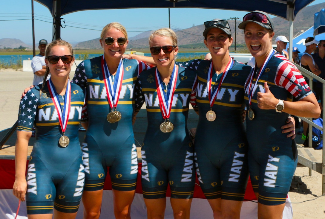 Navy Women capture gold at the 2021 Armed Forces Triathlon Championship held from 8-12 September.  Pictured are:  Lt. Katherine Cullingford, NAS Jacksonville, Fla.; Ensign Carolyn Riggs, US Naval Academy, Md.; Lt. Heather Ireland, NSA Hampton Roads, Va.; Lt. Moira Molloy, Naval Base San Diego, Calif.; Lt. Kylie Petersen, Naval Base San Diego, Calif.  Service members from the Marine Corps, Navy (with Coast Guard) personnel), and Air Force (with Space Force personnel) compete for gold.  (Department of Defense Photo, Released)