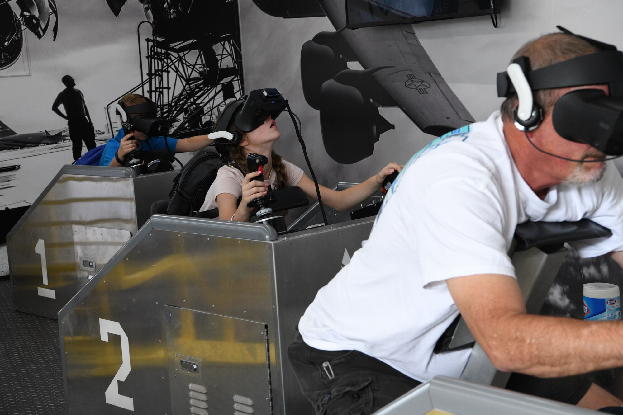 A girl looks through virtual reality goggles during her visit to the Air Force exhibit called "The Hangar" Sept. 17, 2021 at Bristol Motor Speedway, Bristol, Tennessee.