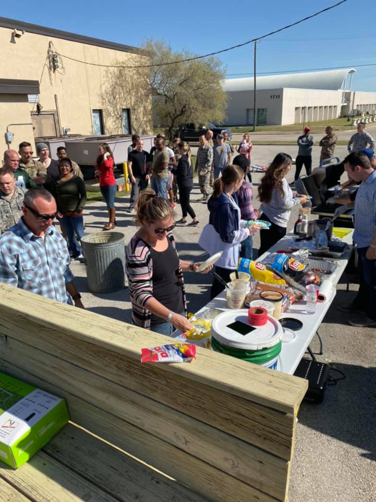 Tech. Sgt. Sean Hill, 73rd Aerial Port Squadron Special Handling Supervisor, serves BBQ for 73d APS family members during the unit’s family day on November 2019 at Naval Air Station Joint Reserve Base Fort Worth, Texas. During this event, more than 100 members unit members and their families were served BBQ. (courtesy photo)