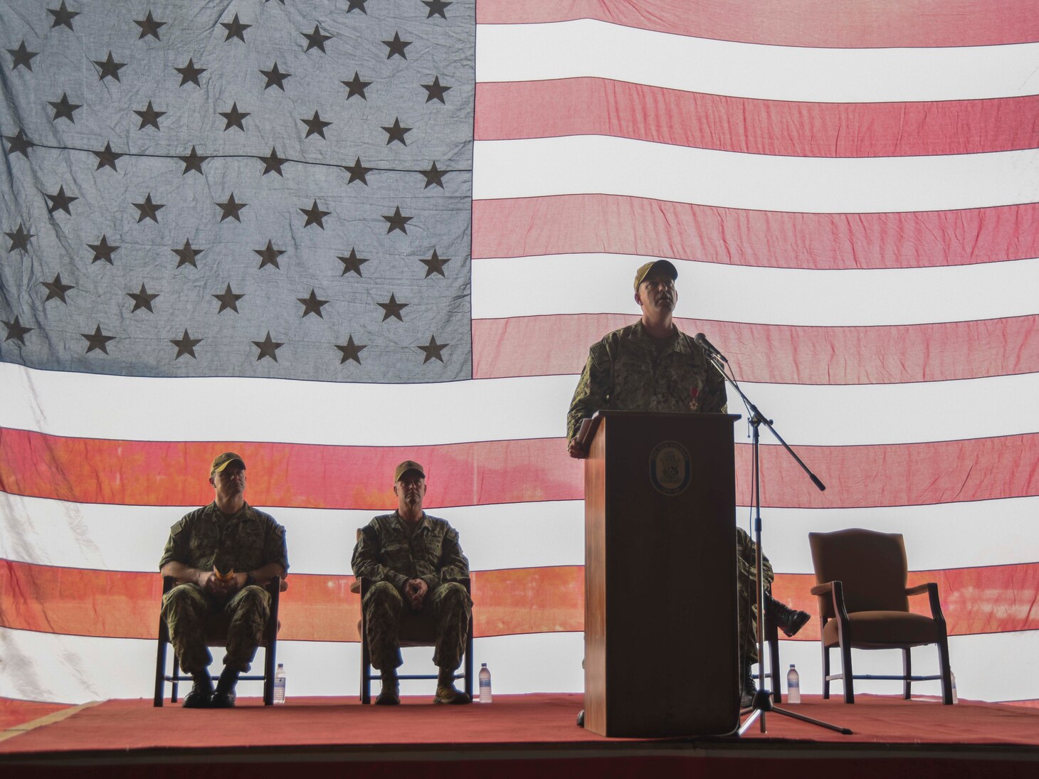 SASEBO, Japan (Sept. 23, 2021) Capt. Brian Schrum, departing commanding officer of USS New Orleans (LPD 18), speaks during his change of command ceremony. New Orleans, part of the America Expeditionary Strike Group, is operating in the U.S. New Orleans, part of the America Expeditionary Strike Group, along with the 31st Marine Expeditionary Unit, is operating in the U.S. 7th Fleet area of responsibility to enhance interoperability with allies and partners and serve as a ready response force to defend peace and stability in the Indo-Pacific region.