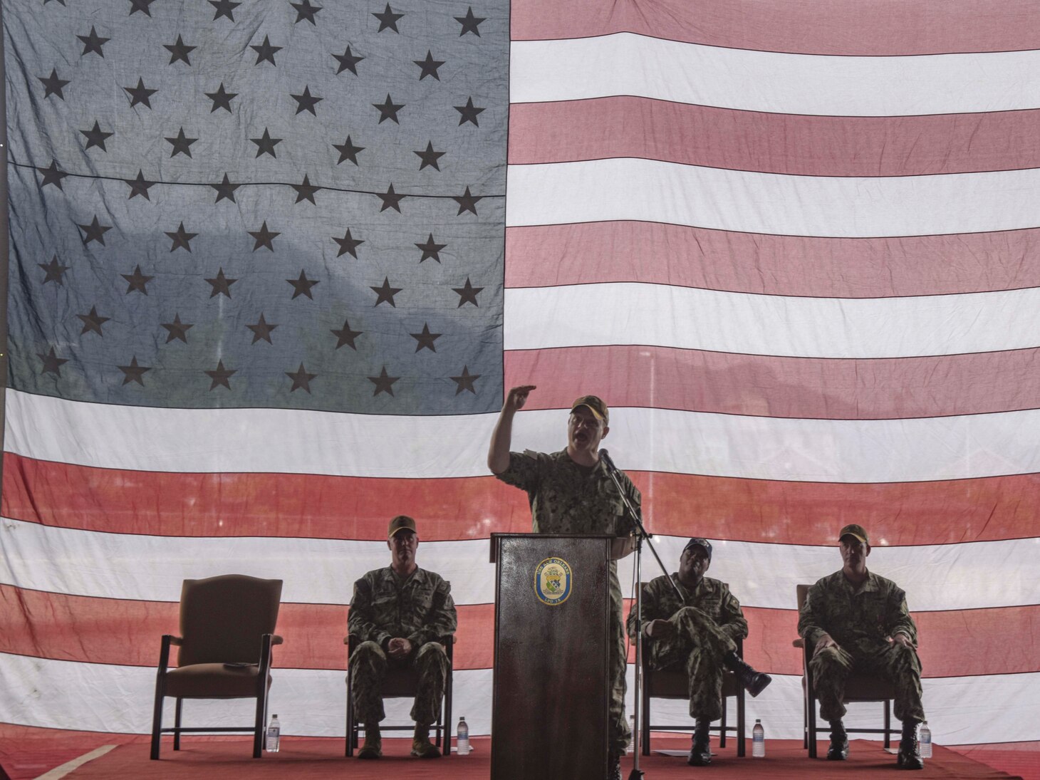 SASEBO, Japan (Sept. 23, 2021) Capt. Douglas Graber, commanding officer of USS New Orleans (LPD 18), speaks during his change of command ceremony. New Orleans, part of the America Expeditionary Strike Group, is operating in the U.S. New Orleans, part of the America Expeditionary Strike Group, along with the 31st Marine Expeditionary Unit, is operating in the U.S. 7th Fleet area of responsibility to enhance interoperability with allies and partners and serve as a ready response force to defend peace and stability in the Indo-Pacific region.