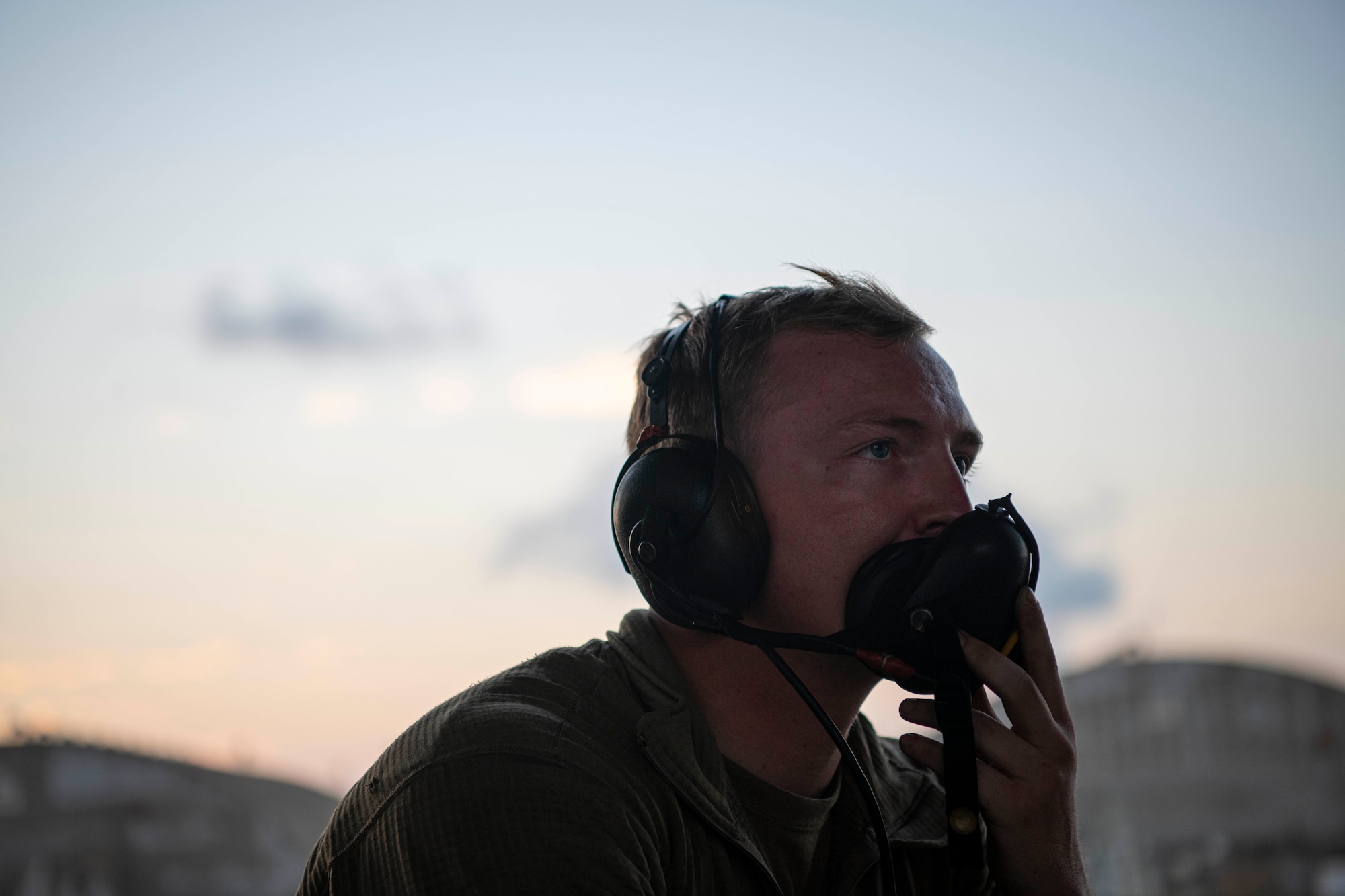 U.S. Air Force Airman 1st Class Austin Woodward, 18th Aircraft Maintenance Squadron crew chief, communicates with an F-15C Eagle pilot during pre-flight checks prior to a night flying training mission at Kadena Air Base, Japan, Sept. 22, 2021. This routine training mission ensured Kadena’s continued readiness to deliver air superiority for the defense of Japan and regional stability across the Indo-Pacific. (U.S. Air Force photo by Staff Sgt. Savannah L. Waters)