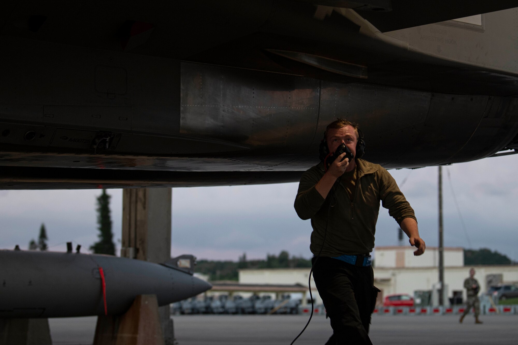 Air Force Airman 1st Class Austin Woodward, 18th Aircraft Maintenance Squadron crew chief, walks around an F-15C Eagle during pre-flight checks at Kadena Air Base, Japan, Sept. 22, 2021. Kadena Airmen regularly train to maintain their capability to provide unrivaled air power in support of U.S. Indo-Pacific Command objectives. (U.S. Air Force photo by Staff Sgt. Savannah L. Waters)