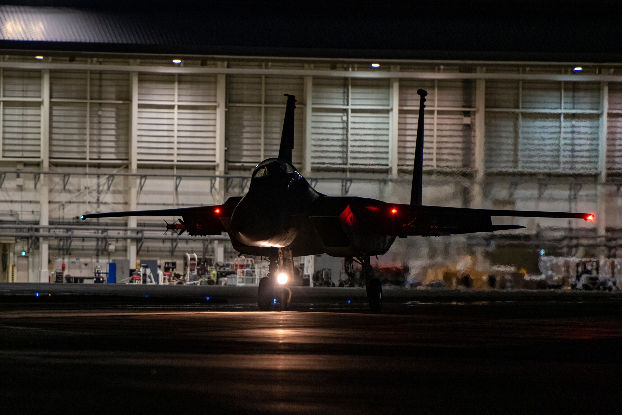 An F-15C assigned to the 44th Fighter Squadron taxis to the end of the runway prior to a night flying training mission at Kadena Air Base, Japan, Sept. 22, 2021. Training missions like this ensure Kadena Airmen are prepared to operate day or night under any conditions. (U.S. Air Force photo by Maj. Raymond Geoffroy)