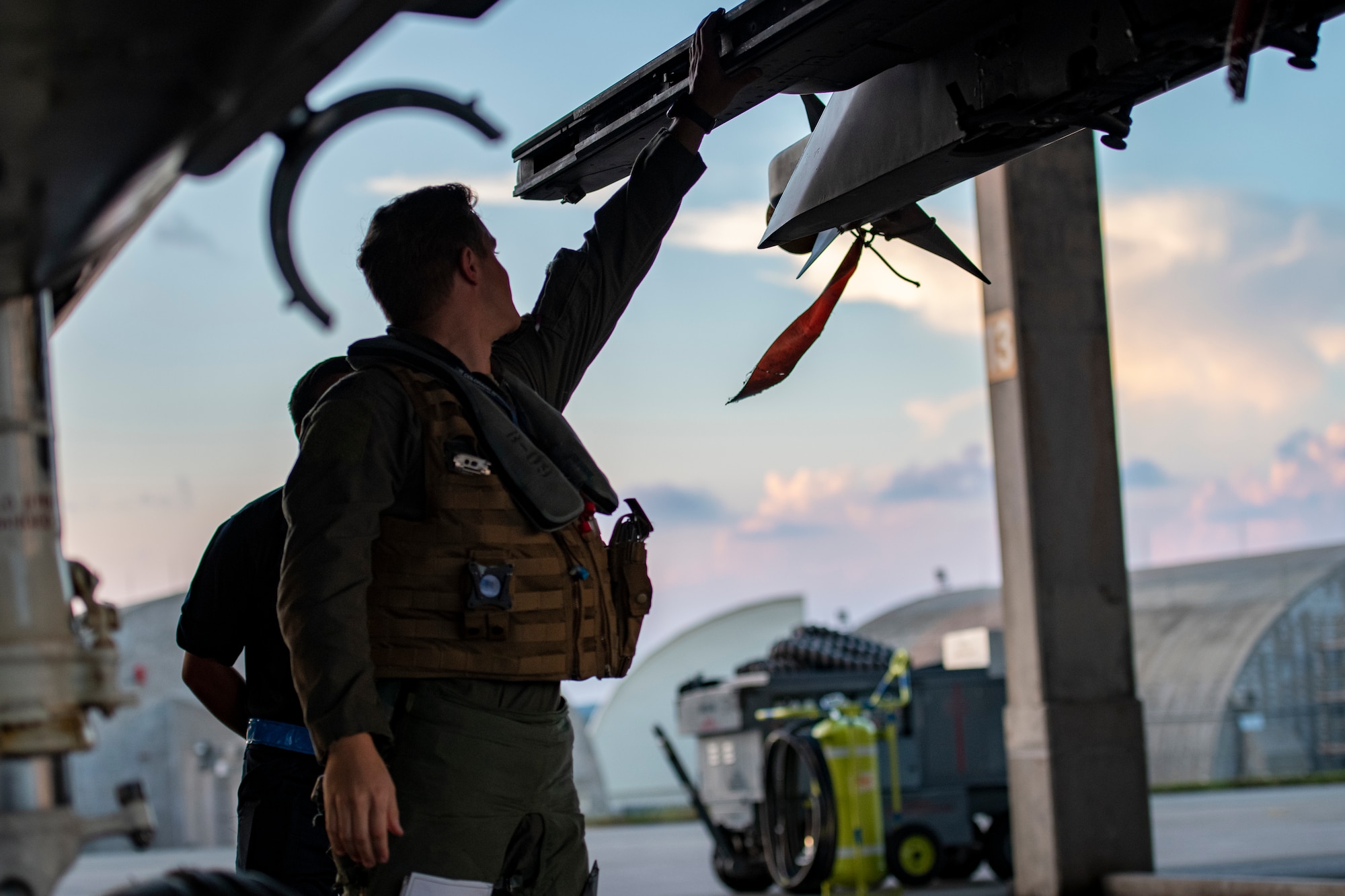 A pilot assigned to the 44th Fighter Squadron performs pre-flight checks on an F-15C Eagle prior to a night flying training mission at Kadena Air Base, Japan, Sept. 22, 2021. This routine training mission ensured Kadena’s continued readiness to deliver air superiority for the defense of Japan and regional stability across the Indo-Pacific. (U.S. Air Force photo by Maj. Raymond Geoffroy)