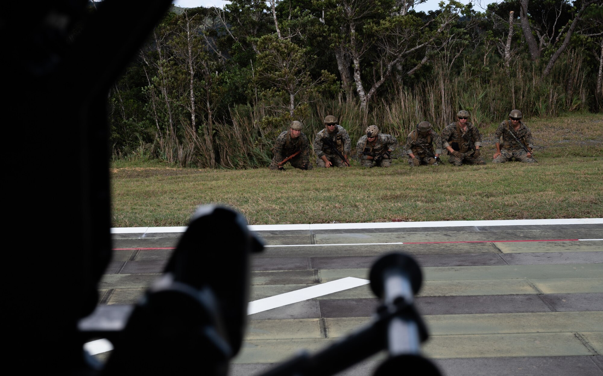 U.S. Marines from the 3rd Reconnaissance Battalion standby to be hoisted up to a 33rd Rescue Squadron HH-60 Pavehawk helicopter at Camp Gonsalves, Japan, Sept. 23, 2021. Recon Marines participate in jungle warfare training to learn how to effectively navigate and survive in the jungle. (U.S. Air Force photo by Airman 1st Class Stephen Pulter)