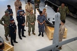 Vice Adm. Brad Cooper, commander of U.S. Naval Forces Central Command (NAVCENT), U.S. 5th Fleet and Combined Maritime Forces, center right, along with Major Gen. Ala Abdulla Seyadi, commander of the Bahrain Coast Guard, center left; and Rear Adm. Mohammed Yousif Al Asam, commander of the Royal Bahrain Naval Force, right, listen to a presentation on remotely operated unmanned underwater vehicles. During the visit, Bahraini leaders committed to partnering with NAVCENT to accelerate integration of new unmanned systems into regional maritime operations. (U.S. Navy photo by Mass Communication Specialist 2nd Class Mark Thomas Mahmod)