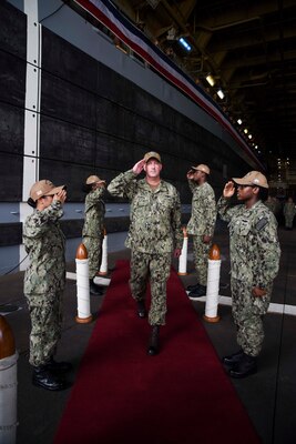 SASEBO, Japan (Sept. 23, 2021) Side boys aboard USS New Orleans (LPD 18) render honors to Capt. Brian Schrum, departing commanding officer of New Orleans, during a change of command ceremony. New Orleans, part of the America Expeditionary Strike Group, is operating in the U.S. New Orleans, part of the America Expeditionary Strike Group, along with the 31st Marine Expeditionary Unit, is operating in the U.S. 7th Fleet area of responsibility to enhance interoperability with allies and partners and serve as a ready response force to defend peace and stability in the Indo-Pacific region.