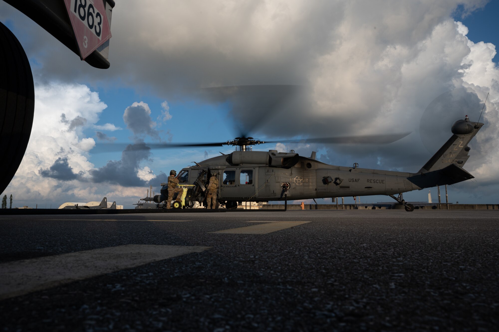 Special mission aviators from the 33rd Rescue Squadron refuel an HH-60 Pavehawk Kadena Air Base, Japan Sept. 23, 2021. SMA’s determine appropriate passenger, fuel and cargo weight for operations. (U.S. Air Force photo by Airman 1st Class Stephen Pulter)