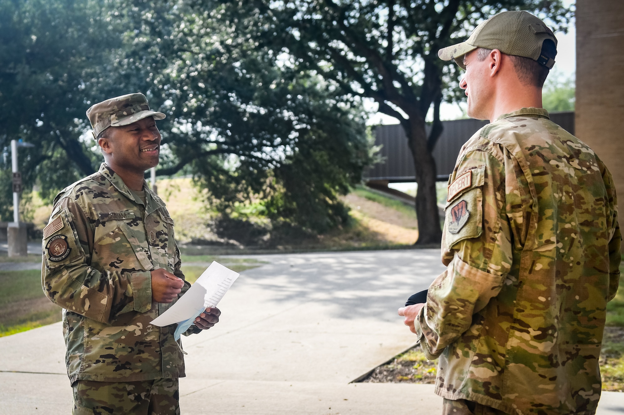 Military recruiter speaking with active duty service member.