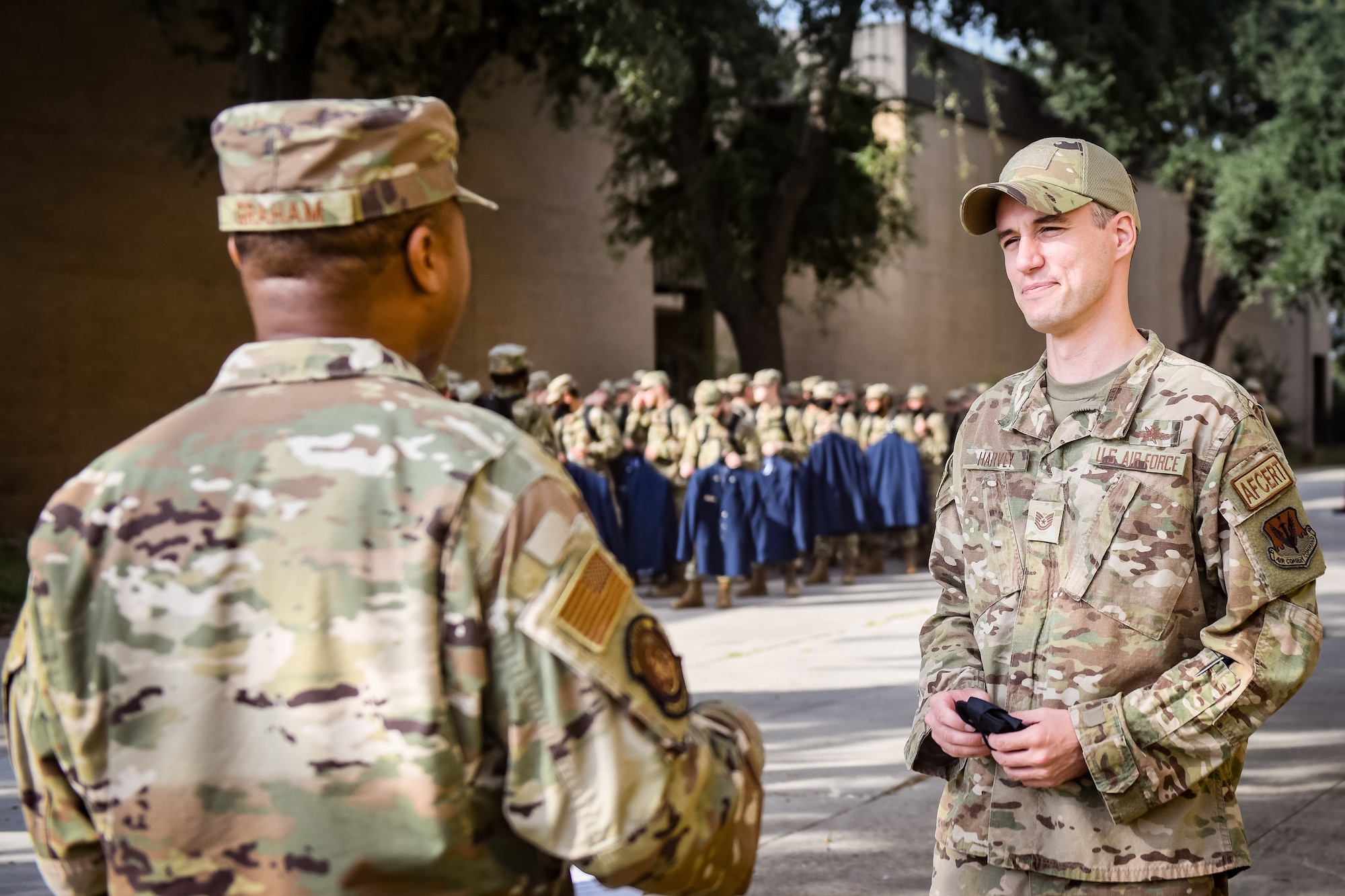 Military recruiter speaking with active duty service member.