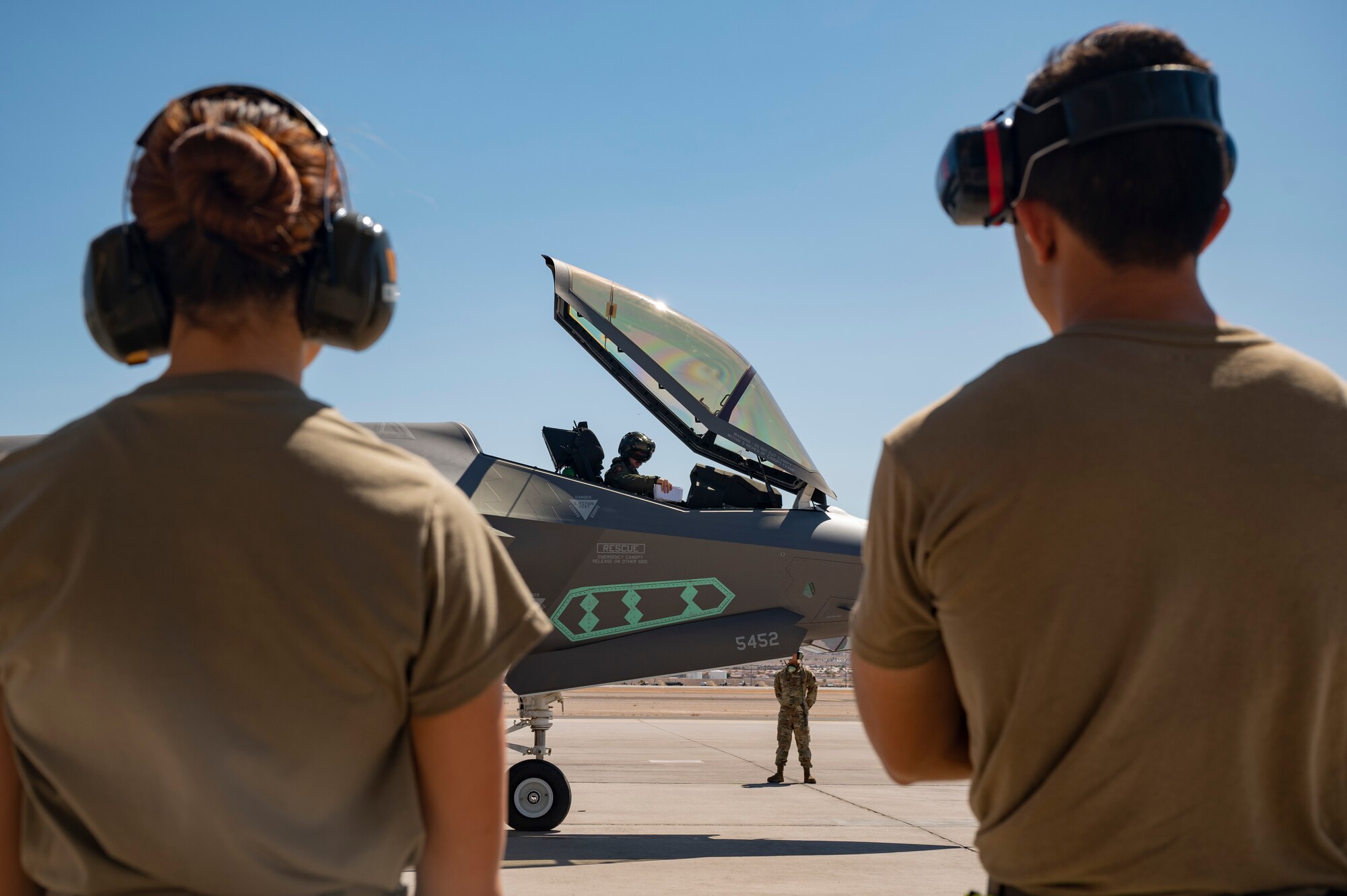 Airmen from the 926th Aircraft Maintenance Squadron  watch as an F-35A Lightning II pilot assigned to the 422nd Test and Evaluation Squadron performs pre-flight checks before launch at Nellis Air Force Base, Nevada, Sept. 21, 2021. The 442nd and 59th Test and Evaluation Squadrons led Air Combat Command’s portion of a nuclear design certification test with maintenance support from the 57th Aircraft Maintenance Squadron and Bolt Aircraft Maintenance Unit. (U.S. Air Force photo by Airman 1st Class Zachary Rufus)