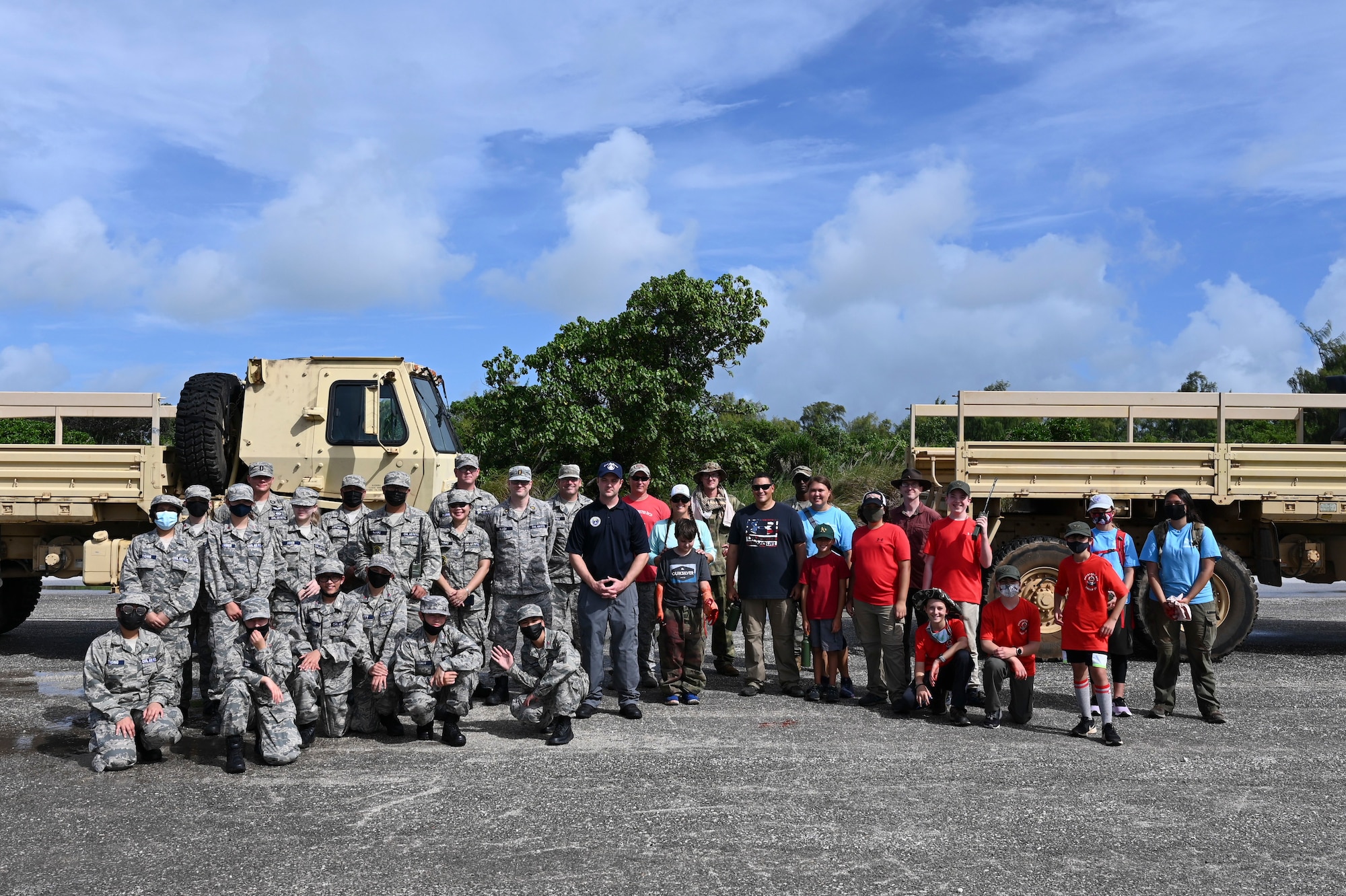 Members of the Andersen Civil Air Patrol Chapter, boy scouts, and volunteers from the 36th Contingency Response Group pose for a group photo during a search and rescue training day at Andersen Air Force Base, Guam, May 22, 2021. Emergency rescue operations is one of three major focus areas within the CAP. Senior Airman Cody Chenowith spends his days balancing his duties at the 36th Civil Engineer Squadron, base Honor Guard and re-launching the Guam CAP chapter, where he leads his team as the Andersen Flight Commander. (U.S. Air Force photo by Tech. Sgt. Esteban Esquivel)