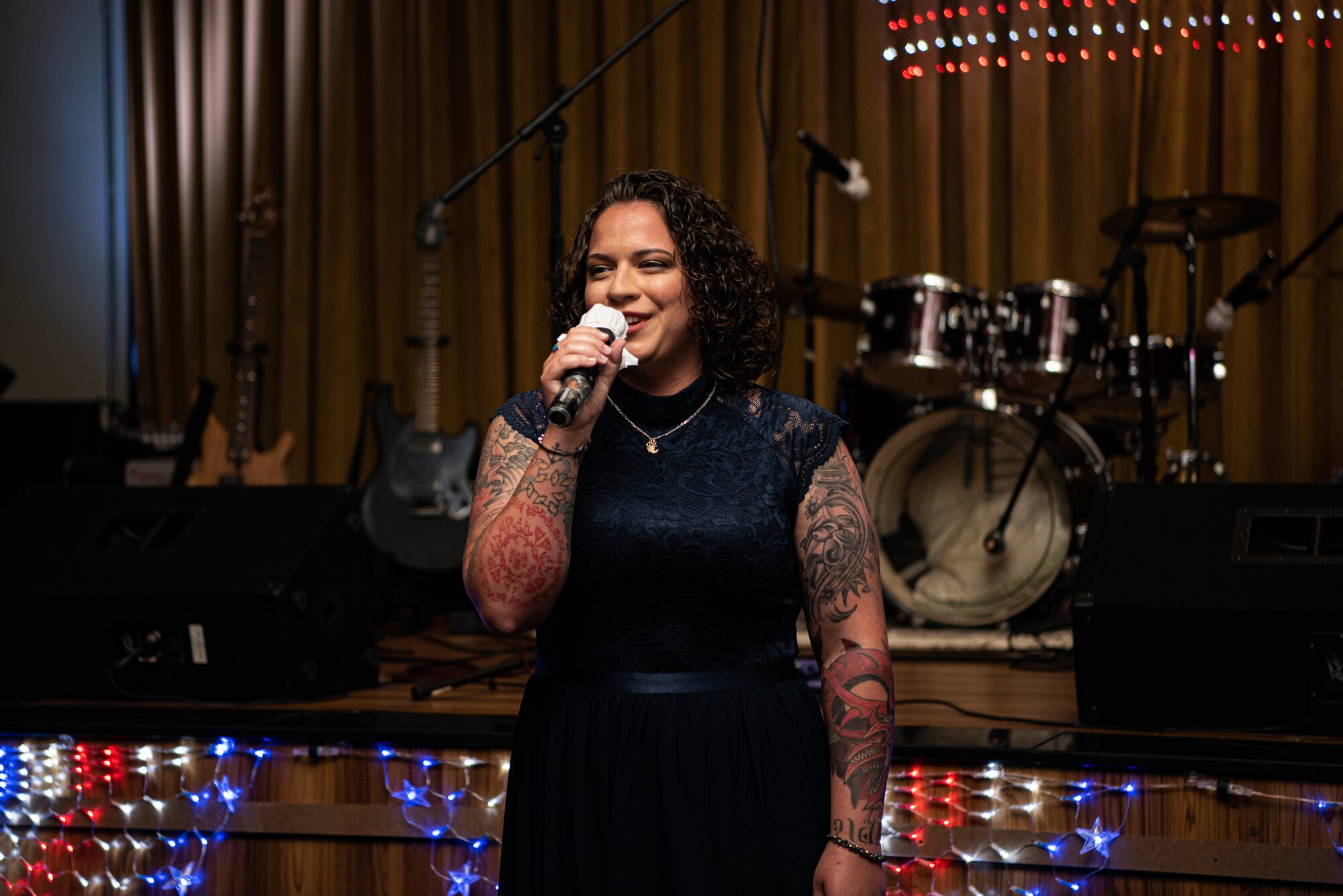 woman singing to an audience