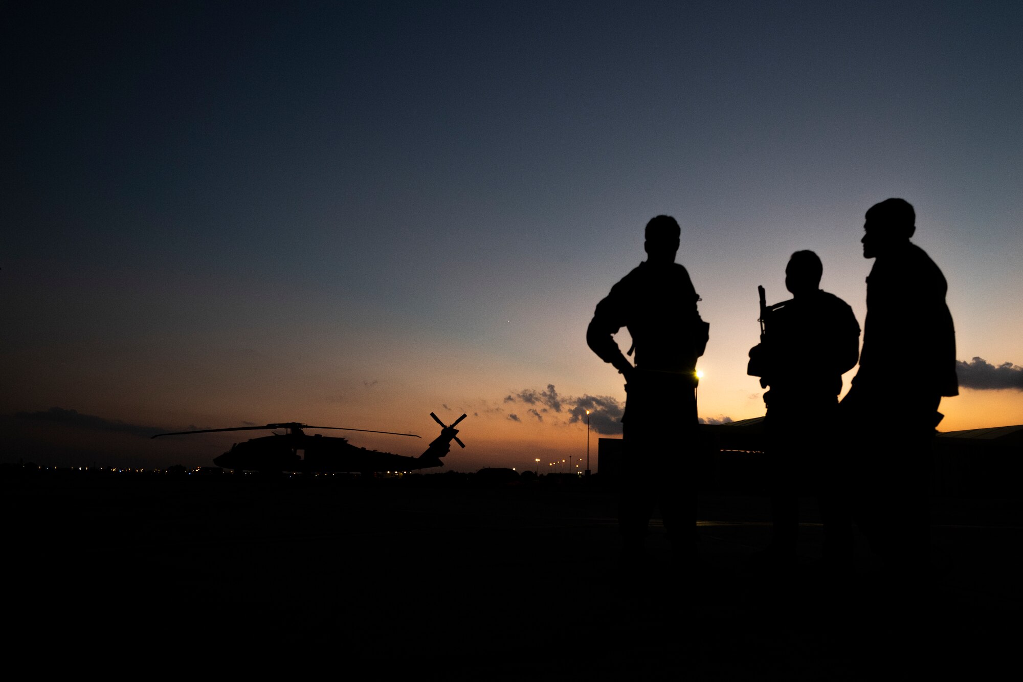 Military working dog handlers from the 39th Security Forces Squadron prepare to execute a joint K-9 helicopter training mission