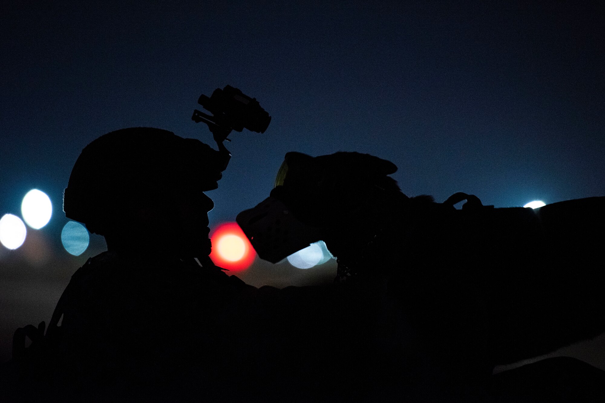 military working dog handler and his military working dog partner Ccura prepare to execute a joint K-9 helicopter training mission