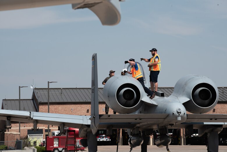 fuels teams members check the oil on an a-10 warthog