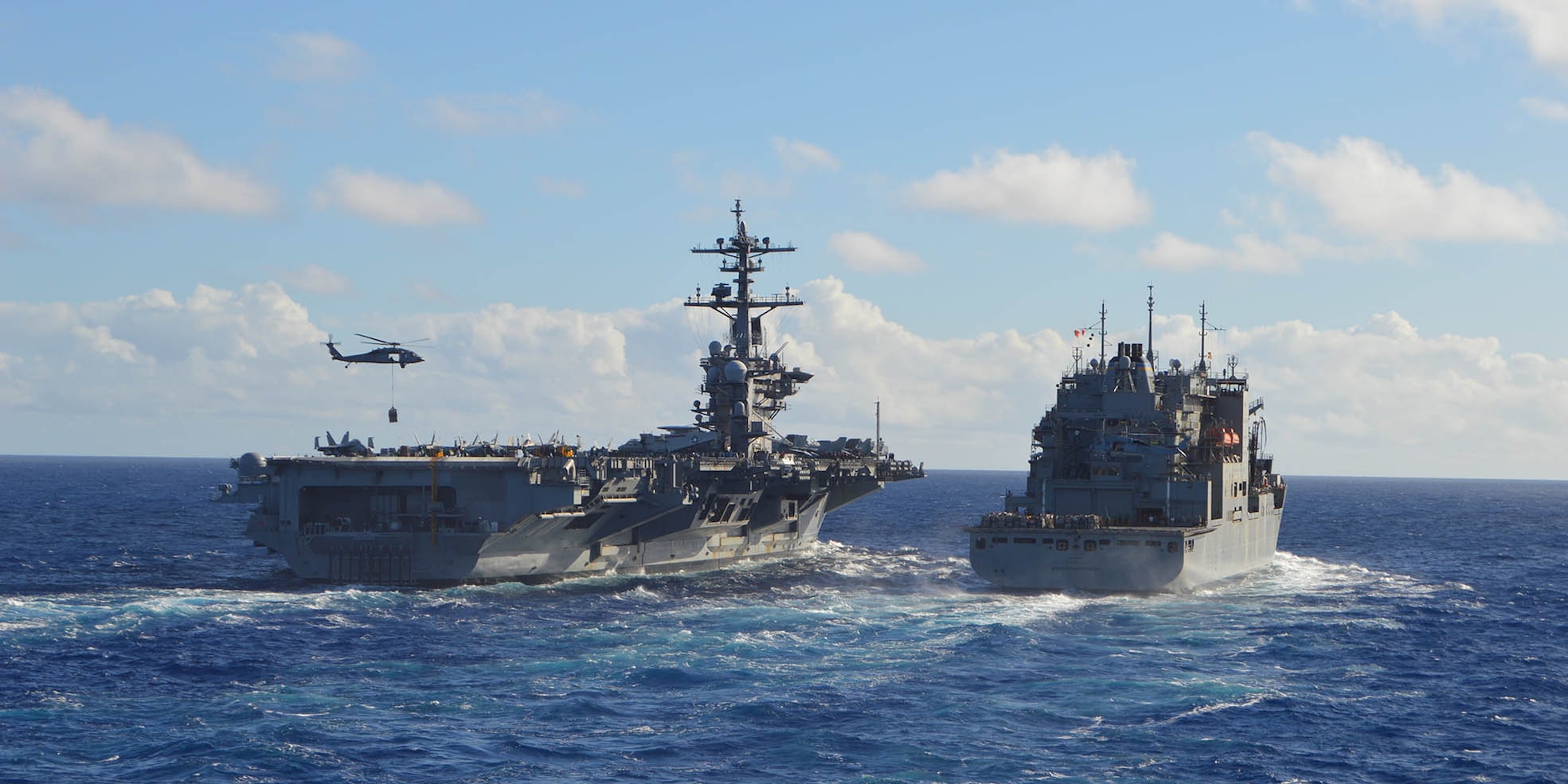 The Nimitz-class aircraft carrier USS Carl Vinson (CVN 70) conducts a replenishment-at-sea with Dry Cargo and Ammunition Ship USNS Washington Chambers (T-AKE 11) on Aug. 13, 2021