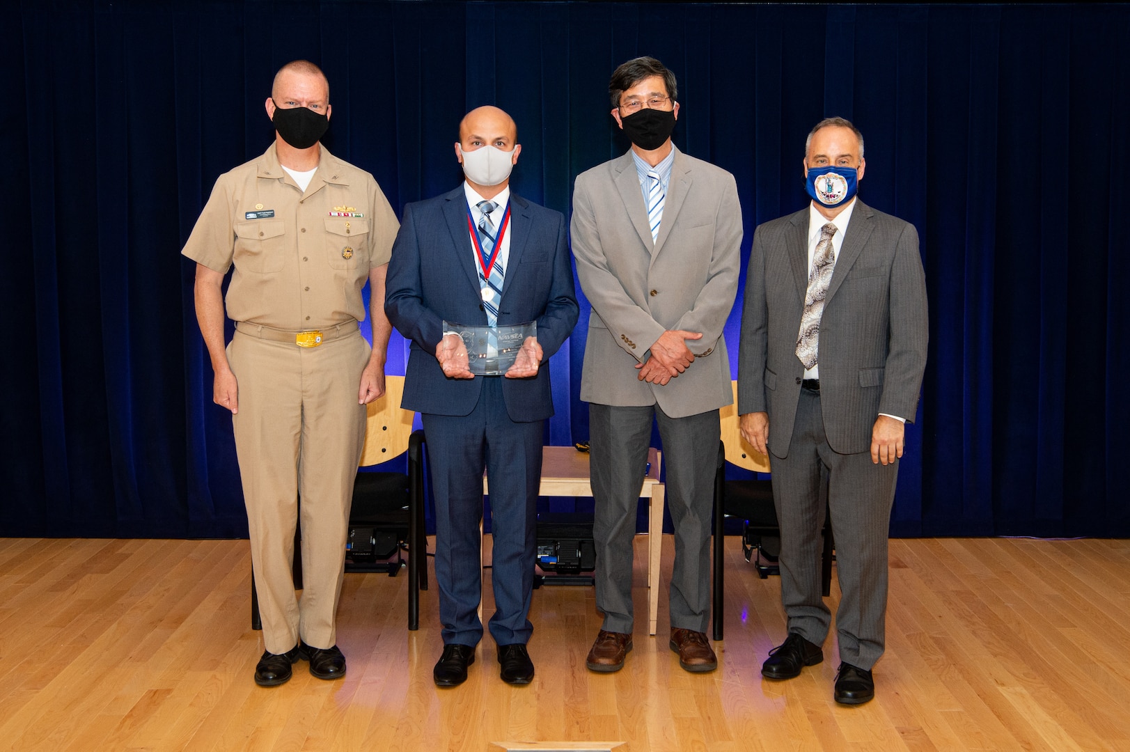 Naval Surface Warfare Center, Carderock Division Commanding Officer Capt. Todd E. Hutchison, Signatures Department Head Paul Shang and Technical Director Larry Tarasek present the Rear Adm. David W. Taylor Award for Outstanding Scientific Achievement to Dr. Alexey Titovich