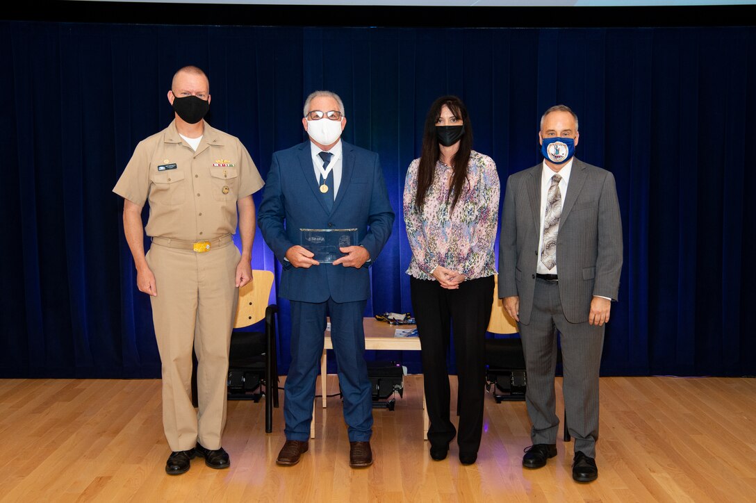 Naval Surface Warfare Center, Carderock Division Commanding Officer Capt. Todd E. Hutchison, Corporate Operations Department Head Tamar Gallagher and Technical Director Larry Tarasek present the Rear Adm. Grace M. Hopper Award.