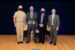 Naval Surface Warfare Center, Carderock Division Commanding Officer Capt. Todd E. Hutchison (left), Platform Integrity Department Head Jeff Mercier (middle right) and Technical Director Larry Tarasek (right) present the Capt. Harold E. Saunders Award for Exemplary Technical Management to Henry “Joe” Venne (middle left) during the Carderock Division Honor Awards ceremony on Sept. 15, 2021.